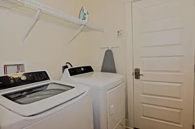 a white laundry room with a washer and dryer at Prominence 30A - Mint Julep in Inlet Beach