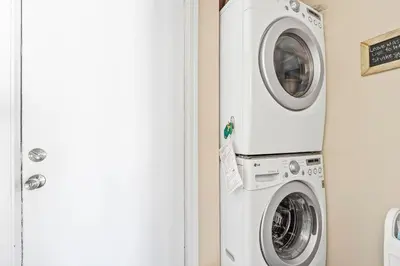 a washing machine and a dryer in a room at High Cotton Beach Cottage in Inlet Beach