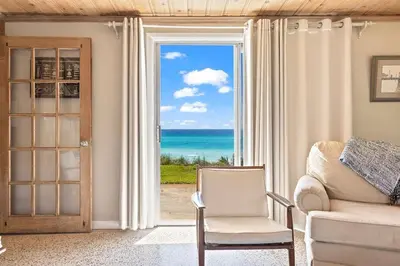 a living room with a view of the ocean at The Perfect View in Santa Rosa Beach