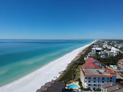 an aerial view of a beach with houses and the ocean at Time To Coast in Santa Rosa Beach