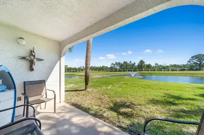 a view from the porch of a house with a view of a lake at Edgewater Villa 1908 in Panama City Beach