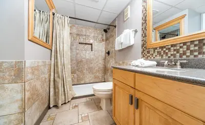 a bathroom with a toilet and a sink at Edgewater Tower III 513 in Panama City Beach