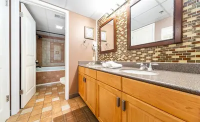 a bathroom with a sink and a mirror at Edgewater Tower III 513 in Panama City Beach