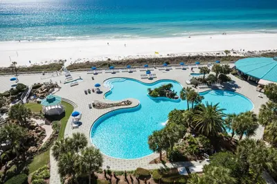 an aerial view of a resort swimming pool and the beach at Edgewater Villa #604 in Panama City Beach