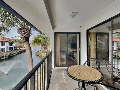 a balcony with a table and a view of the water at Edgewater Villa #2209 in Panama City Beach