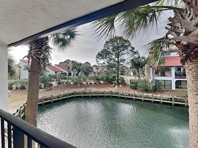 a view of a river from a balcony at Edgewater Villa #2209 in Panama City Beach