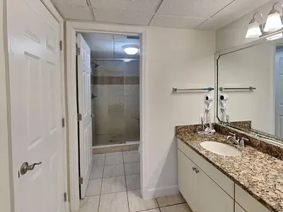 a bathroom with a sink and a shower at Edgewater Tower I 211 in Panama City Beach