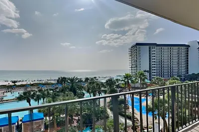 a view of the beach from the balcony of a resort at Edgewater Tower I 406 in Panama City Beach