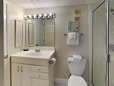a bathroom with a toilet and a sink and a shower at Edgewater Tower I 610 in Panama City Beach