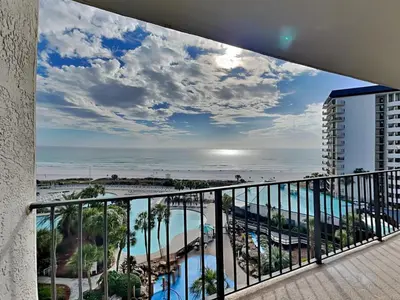 a balcony with a view of the beach and ocean at Edgewater Tower I 610 in Panama City Beach