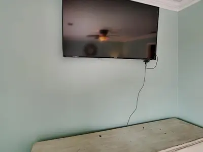 a tv hanging on a wall in a room at Edgewater Villa 1216 in Panama City Beach