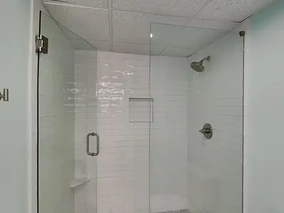 a shower with a glass door in a bathroom at Edgewater Villa #2505 in Panama City Beach