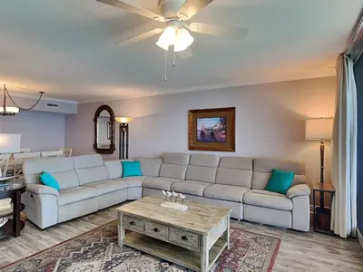 a living room with a couch and a table at Emerald Beach #2535 in Panama City Beach