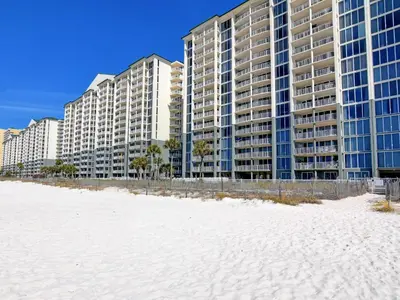 a row of tall buildings on the beach with a white beach at Long Beach Resort Tower I #506 in Panama City Beach