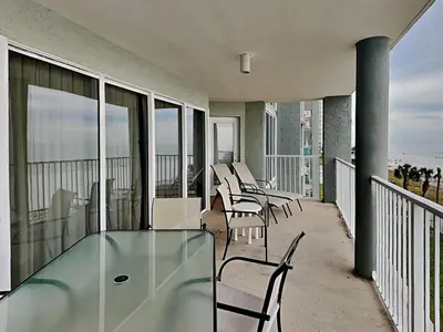 a balcony with a glass table and chairs on it at Long Beach Resort Tower II #306 in Panama City Beach