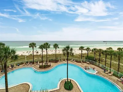 a view of a swimming pool and the beach at Grand Panama Beach Resort - The Grand #403 in Panama City Beach