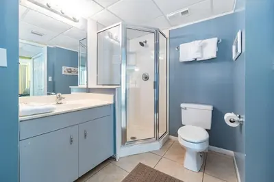 a bathroom with a toilet sink and a shower at Long Beach Resort Tower I #900E in Panama City Beach
