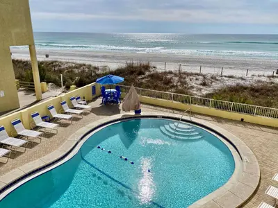 a swimming pool with a beach in the background at Continental 319 in Panama City Beach