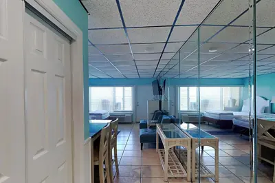 a hospital room with a table and a bed at Continental 419 in Panama City Beach