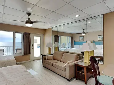 a living room with a couch and a bed at Continental 503 in Panama City Beach