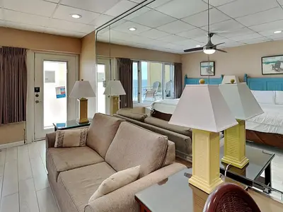 a living room with a couch and a bed at Continental 503 in Panama City Beach