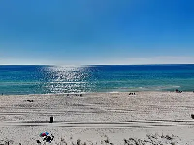 a beach with people on the sand and the ocean at Continental 503 in Panama City Beach