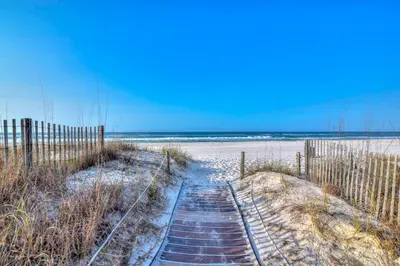 a path to the beach with snow on the sand at Continental Condominiums 3 in Panama City Beach