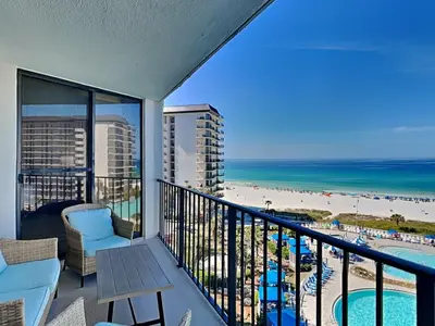 a balcony with a view of the beach and the ocean at Edgewater Tower I 704 in Panama City Beach