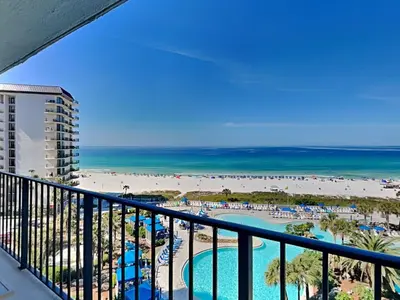 a view of the beach from the balcony of a resort at Edgewater Tower I 704 in Panama City Beach