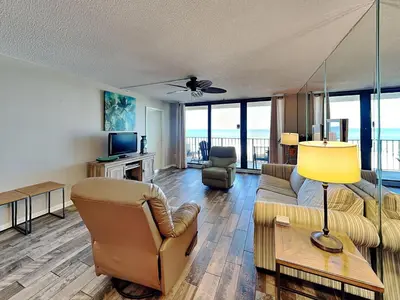 a living room with a couch and a table at Edgewater Tower II #204 in Panama City Beach