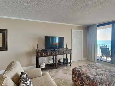 a living room with a tv and a couch at Edgewater Tower Ii 504 in Panama City Beach