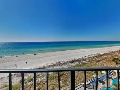 a view of a beach from a balcony at Edgewater Tower Ii 504 in Panama City Beach
