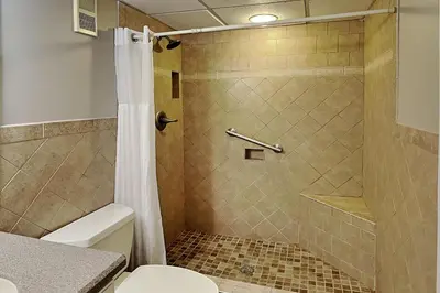 a bathroom with a shower and a toilet at Edgewater Tower III #607 in Panama City Beach