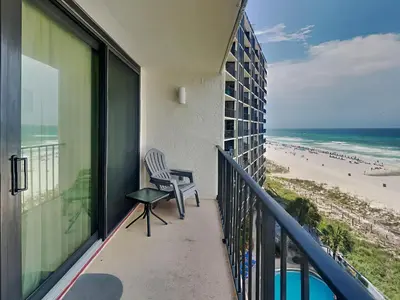 a balcony with a chair and a view of the beach at Edgewater Tower III #609 in Panama City Beach