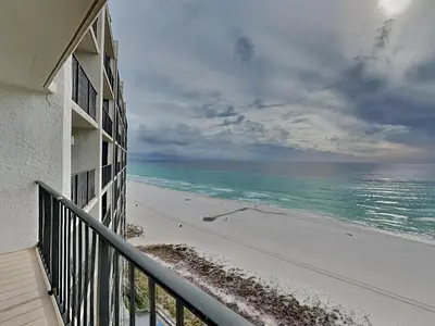 a view of the beach from the balcony of a building at Edgewater Tower III 1006 in Panama City Beach