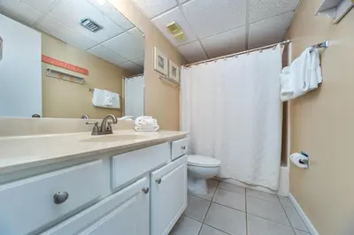 a bathroom with a sink and a toilet at Edgewater Leeward #302 in Panama City Beach