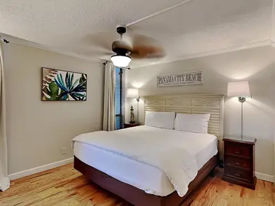 a bedroom with a large white bed in a room at Edgewater Leeward #605 in Panama City Beach