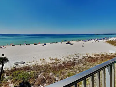 a view of the beach from a balcony at Edgewater Windward #305 in Panama City Beach