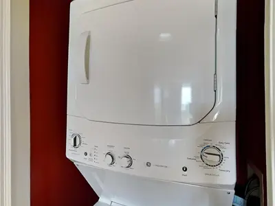 a white washer and dryer in a room at Edgewater Windward #602 in Panama City Beach