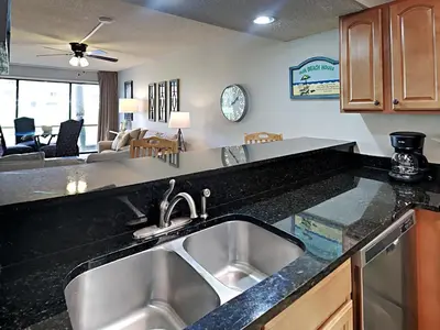 a kitchen with a sink and a counter top at Edgewater Villa #404 in Panama City Beach