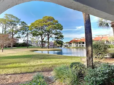a view of a park with a river and houses at Edgewater Villa #703 in Panama City Beach