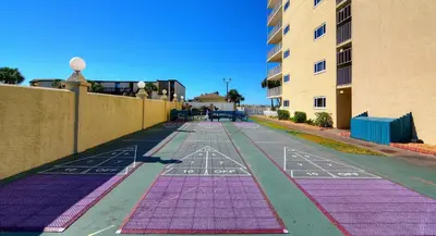 an empty street with purple and pink mats on the ground at Summit Beach Resort #901 in Panama City Beach