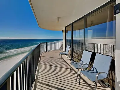 a balcony with chairs and a view of the beach at Edgewater Tower III 1114 in Panama City Beach