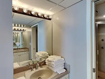 a bathroom with a sink and a mirror at Edgewater Tower III 1114 in Panama City Beach