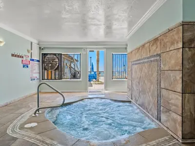 a jacuzzi tub in the middle of a room at Regency Towers 1202 in Panama City Beach