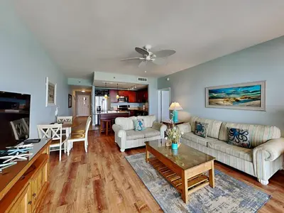 a living room with a couch and a table at Laketown Wharf 1907 in Panama City Beach