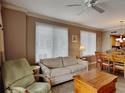 a living room with a couch and a table at Grandview East #1005 in Panama City Beach