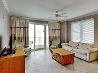 a living room with a couch and a table at Grandview East #1005 in Panama City Beach