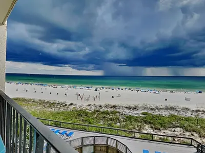 a view of the beach from the balcony of a condo at Edgewater Tower II in Panama City Beach