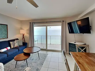 a living room with a couch and a table at Summit Beach Resort 1230 in Panama City Beach
